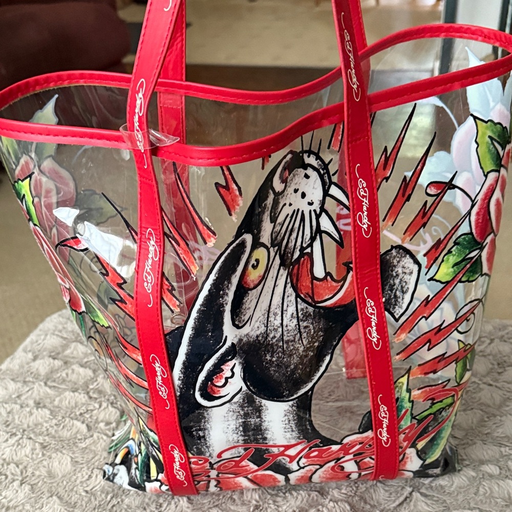 $20 SALE!!
 Preowned Ed Hardy Clear Tote with Red and Black Panther Graphic
